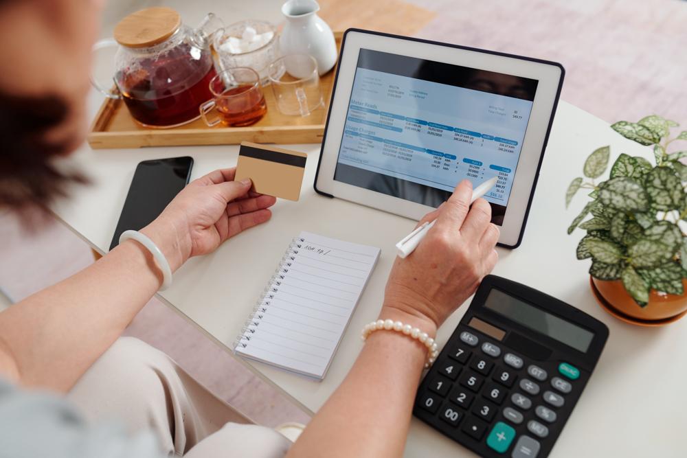 person using quickbooks to manage personal finances