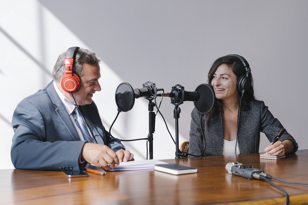 Two business people having a podcast discussion