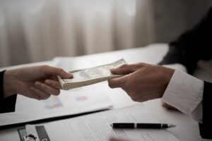Businessman lending money to another person
