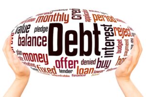Person holding a word cloud with debt terms