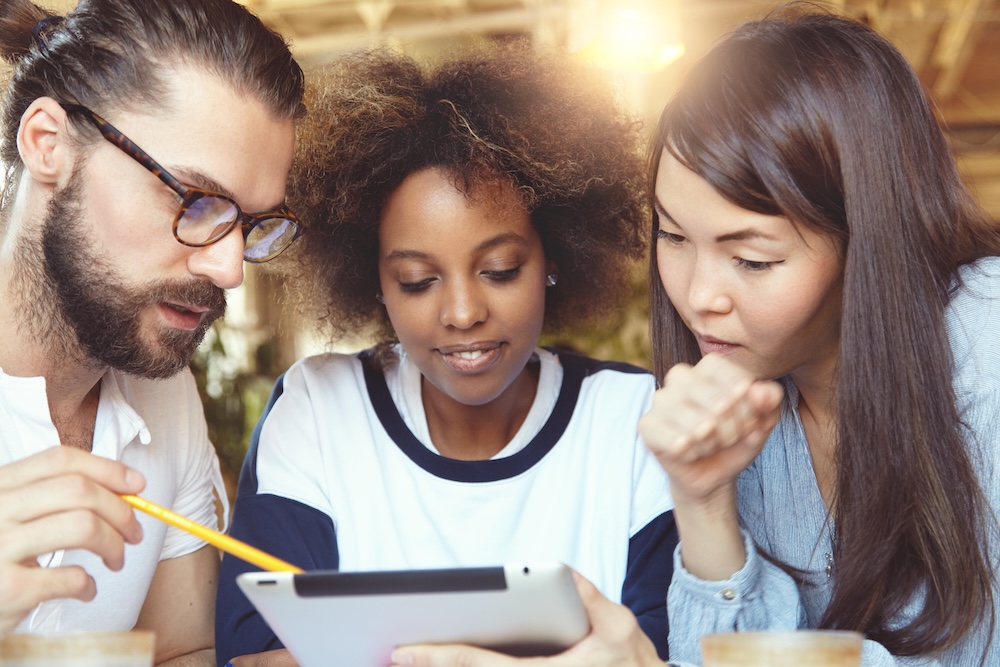 Young international students using a mobile device
