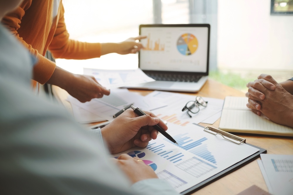 People discussing financials at a desk