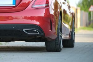 Close up of a red car parked on the street