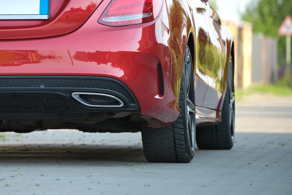 Close up of a red car parked on the street