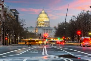 capital hill at dusk in washington dc with stop lights