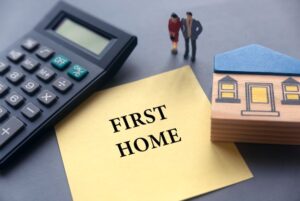 First Home flyer with wooden house and calculator